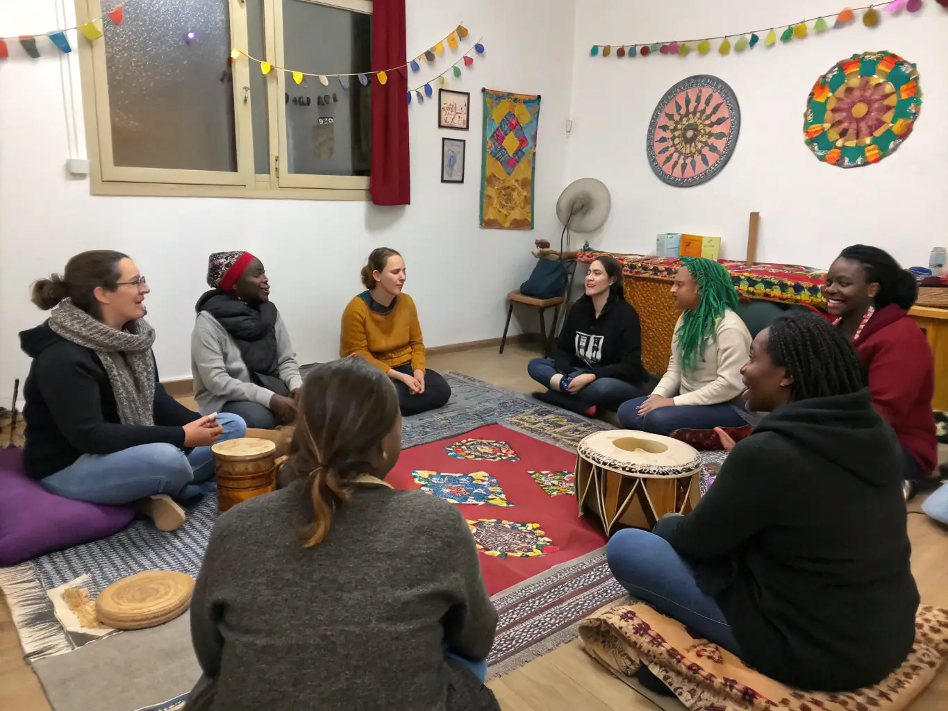 A photograph capturing participants from diverse cultural backgrounds sharing experiences and engaging in discussions during a Cultural Exchange event.